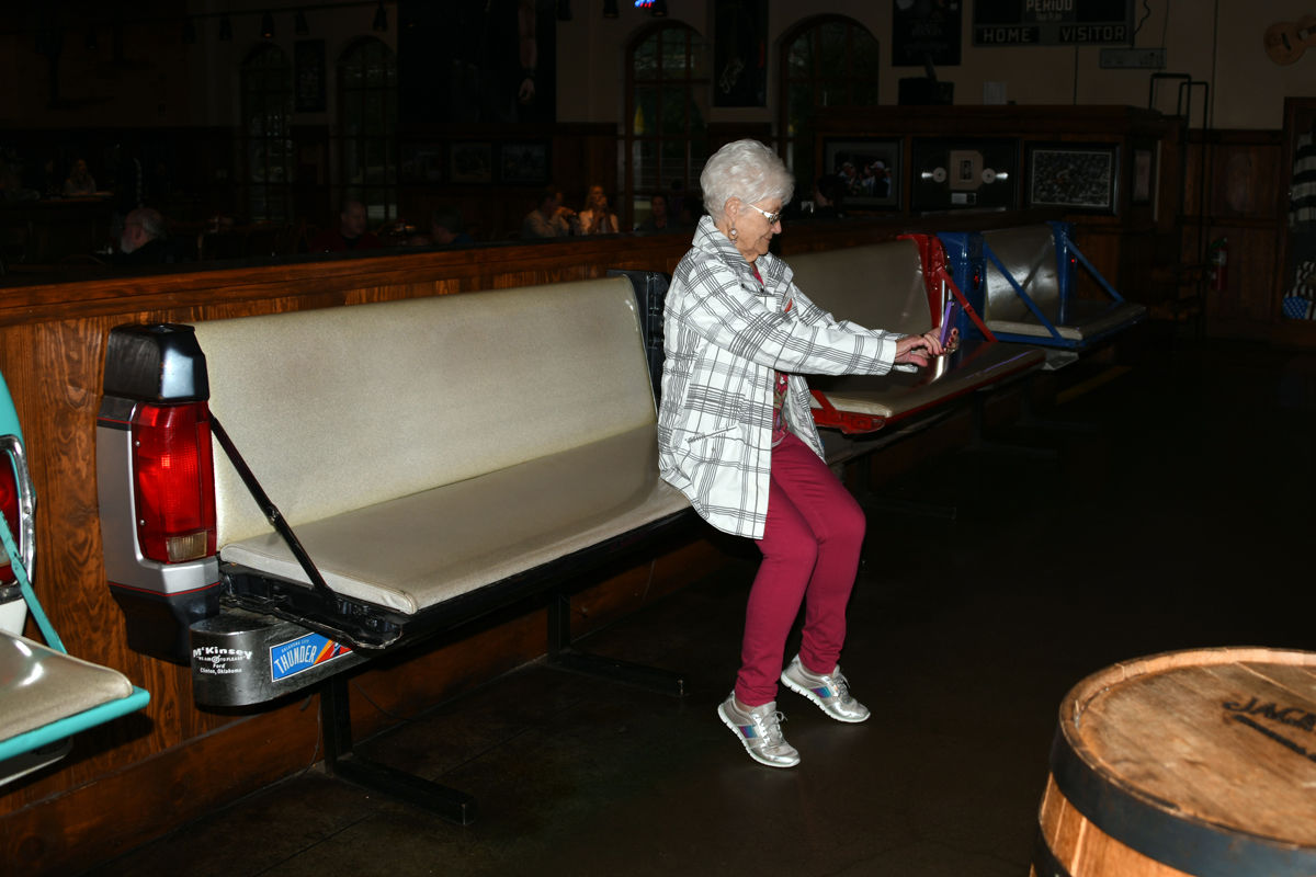 008 Frieda Goertzen - selfie on unique tailgate benches at Toby Keith's restaurant.JPG